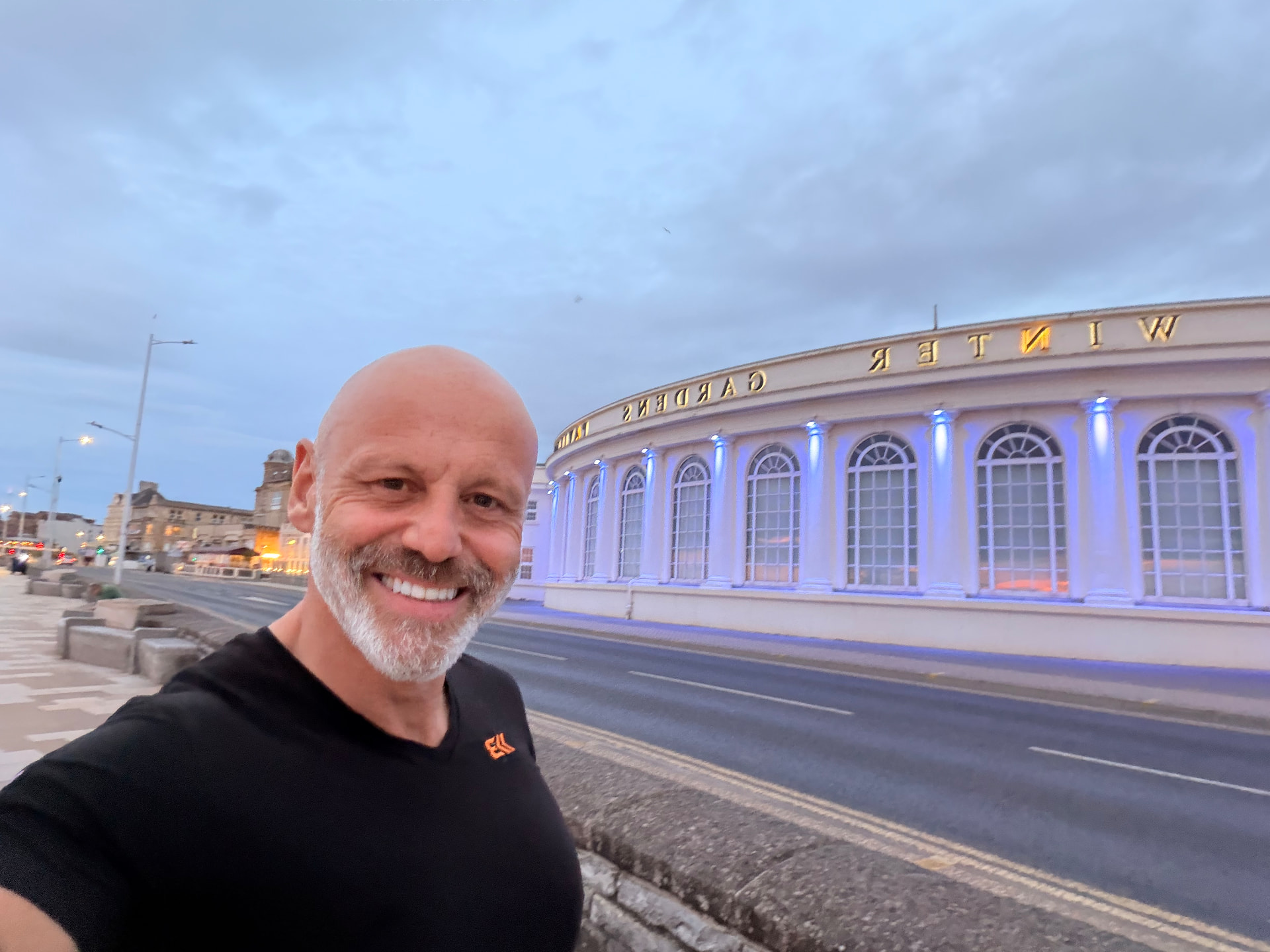 Brad Burton smiling outside Weston's Winter Gardens