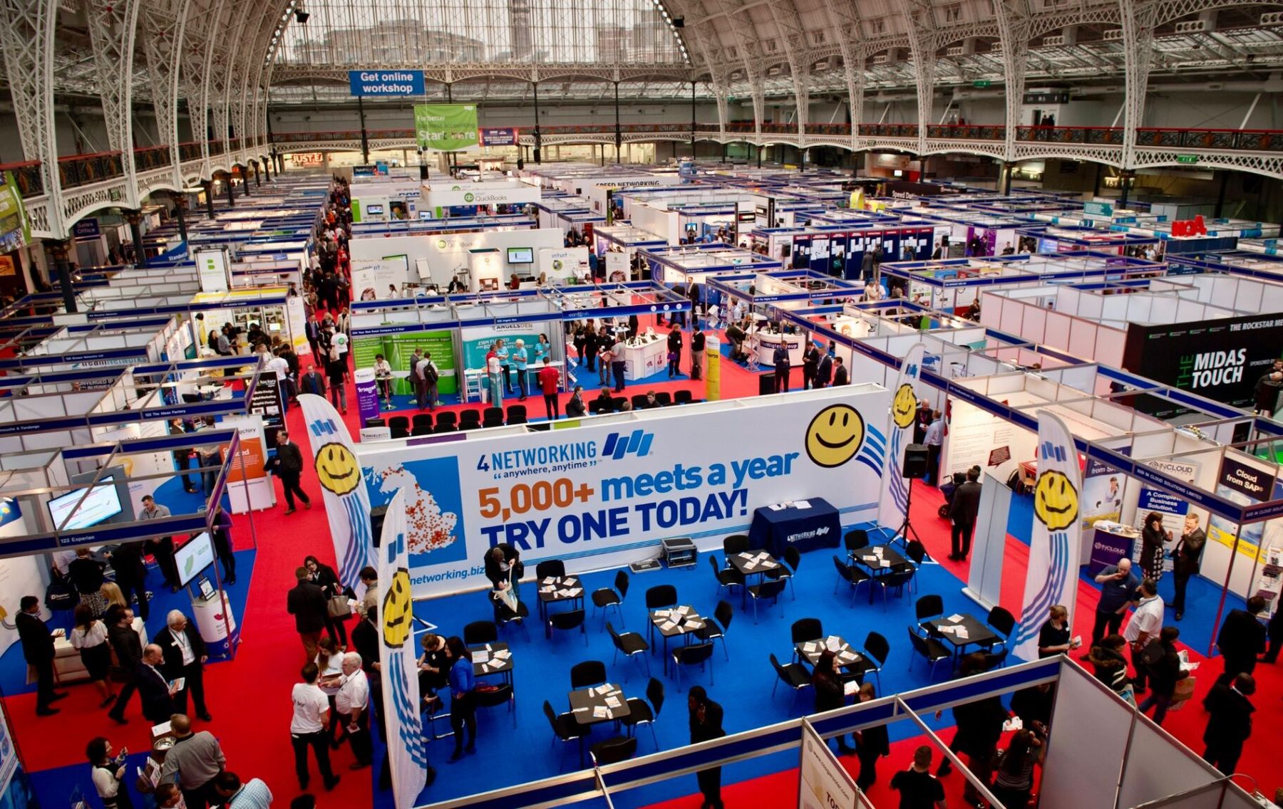 Aerial view of the packed 4Networking stand at The Business Show, Olympia - '5,000+ meets a year, try one today'