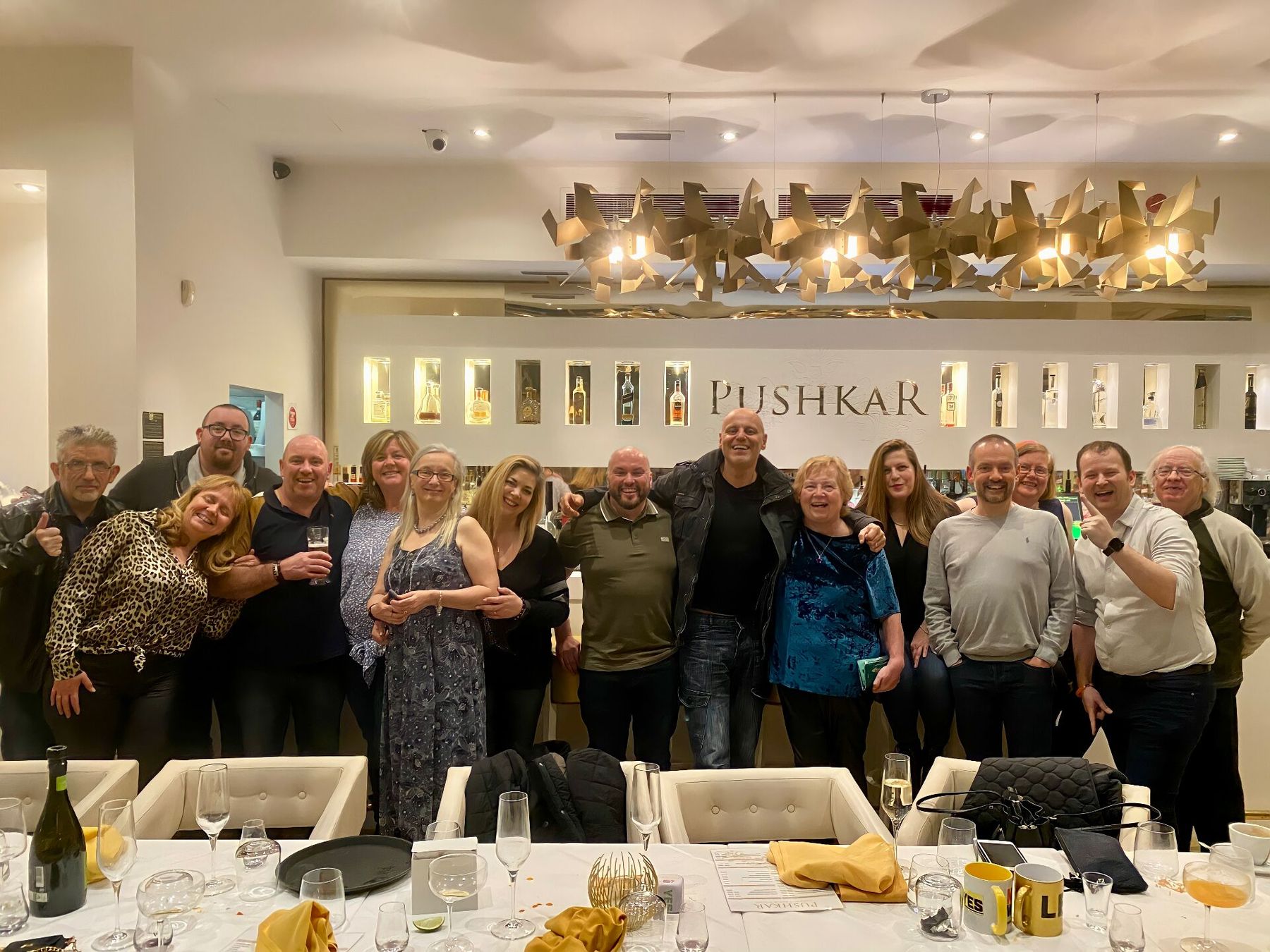 Brad with a group of friends and clients celebrating at Pushkar restaurant
