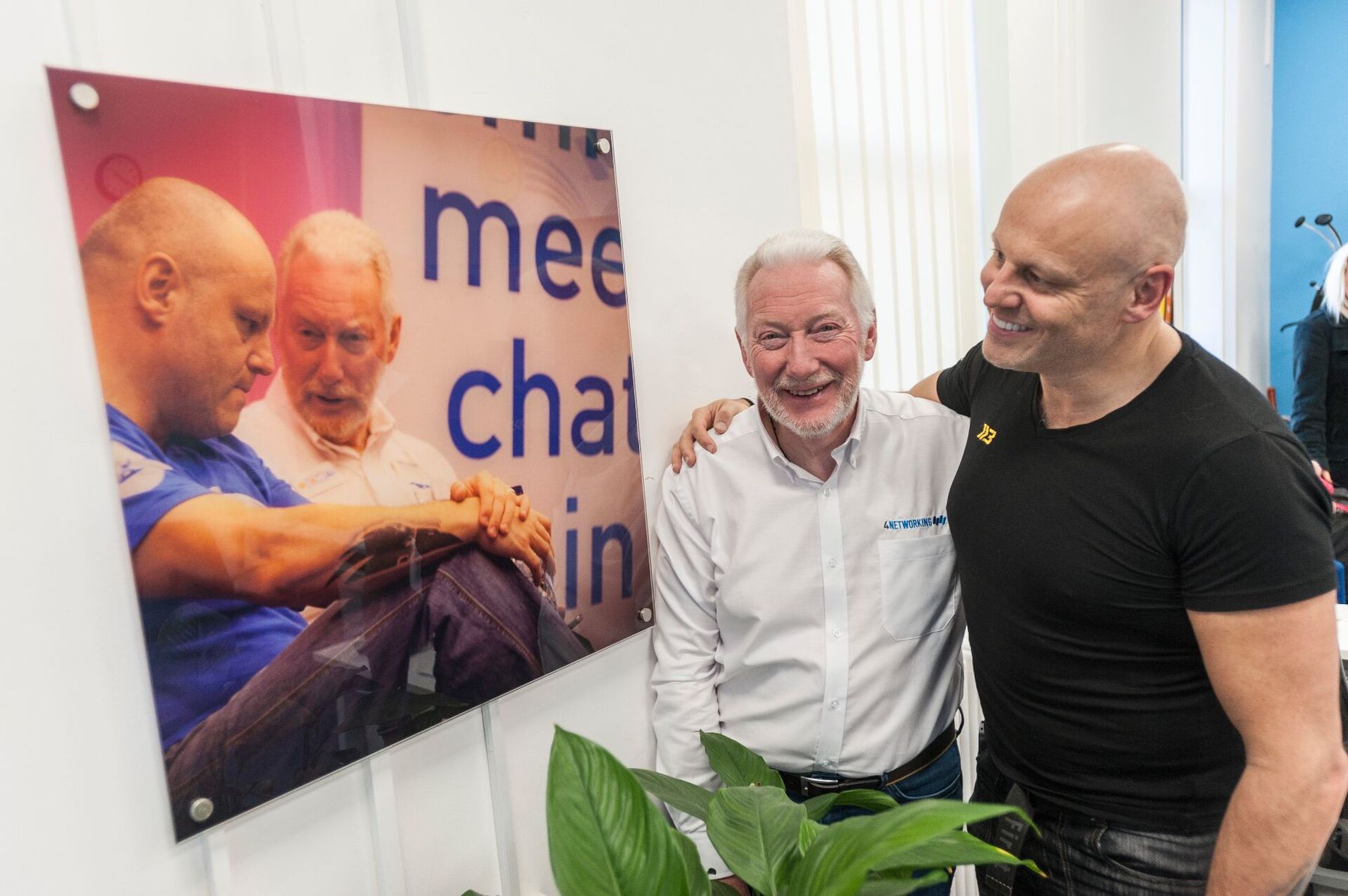 Brad with 4Networking founder Tim Johnson, arms around each other, laughing